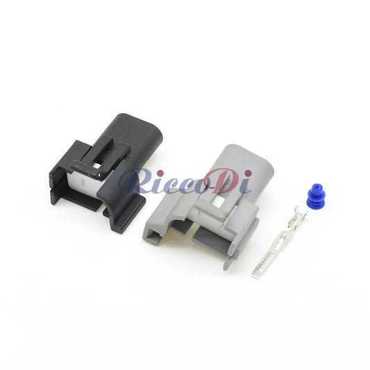 Close-up of male 2-pin automotive connector DJ7022A-3-11 DJ7022B-3-11 highlighting secure pins and compact housing