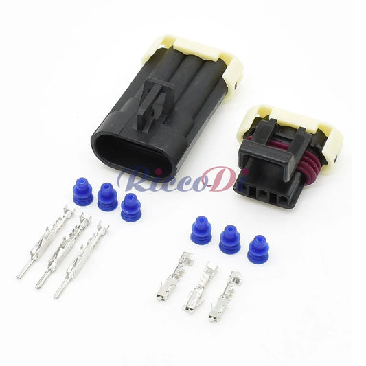 Close-up of 3-pin automotive wire connector front lamp socket 1212961 12129615 12110293 showing male female pins