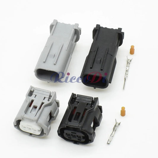 Close-up of 3-pin headlight camshaft sensor plug showing secure male and female terminals for Toyota and Lexus vehicles