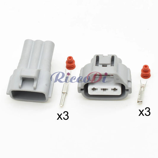Close-up of 3-pin turn signal headlight wiring connector showing male and female plug terminals for secure automotive wiring