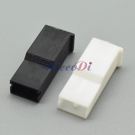 Close-up of black and white plastic female plug on 6.3 series automotive wiring harness connector 171809-3