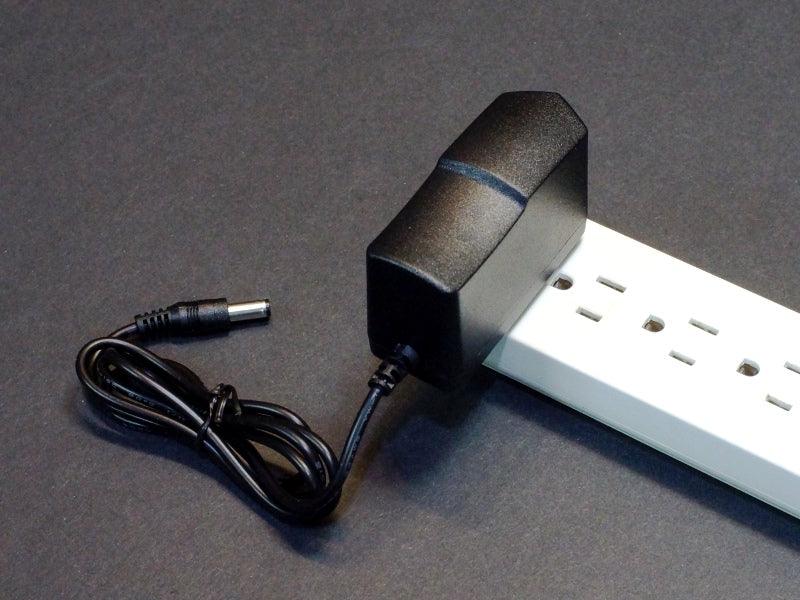AC-Adapter-12V-2A-Slim-Plugged-into-Strip