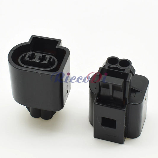 Close-up of 2-pin ABS sensor connector 6N0973702 highlighting secure pins and waterproof housing