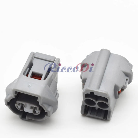 Close-up of 2-pin auto wire harness plug DJ7023YB-2.2-21 showing secure terminals and durable housing