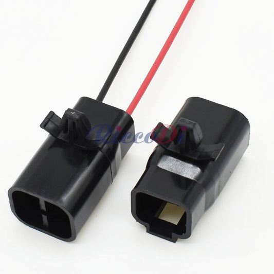 Close-up view of black 2 pin male automotive connector showing detailed pin design and construction