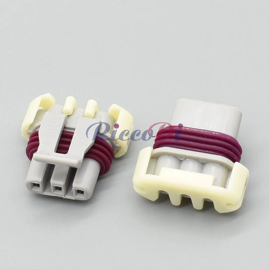 Close-up of 3-Pin terminals of Buick and Chevrolet ignition coil connector 121209946 for secure electrical connection