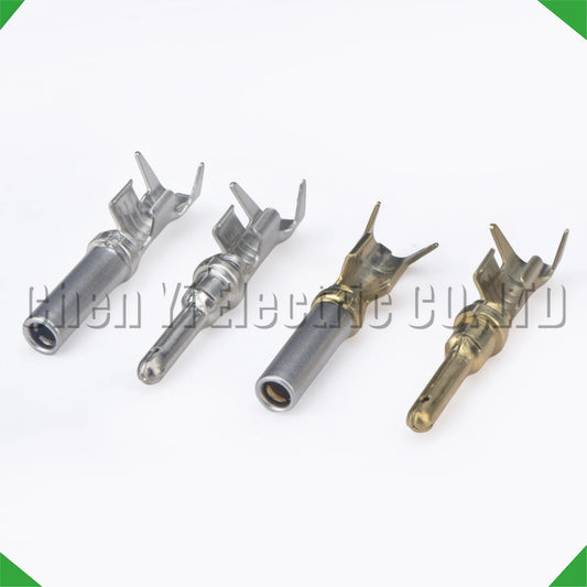 Close-up of 2.3mm male and female wire crimp pins for automotive connectors