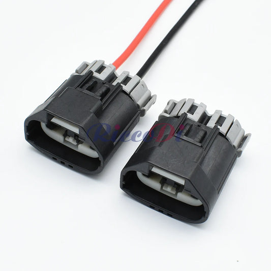 Close-up of 2 pin terminals for automotive power steering pump and fan electrical connector