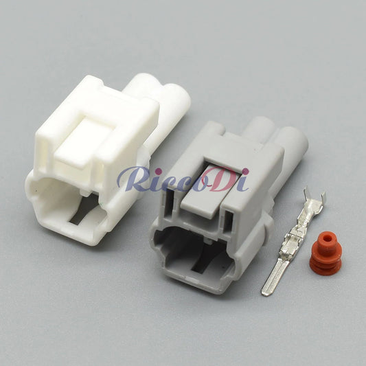 Close-up of automotive unsealed wire harness connector showing precise socket interface