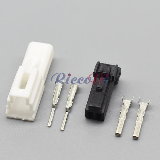 Close-up of automotive unsealed wire harness connector showing precise socket interface