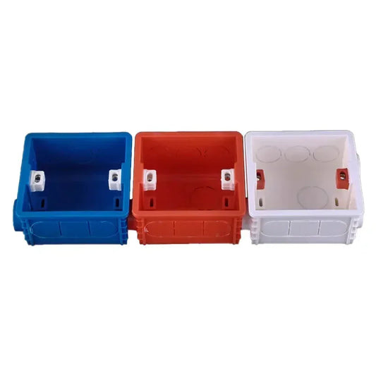 Close-up of Type 86 recessed wall mounting box with wire slots for switch and socket installation, white and blue
