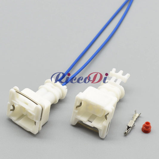 Close-up of 2-hole female automotive connector highlighting pins and wire attachment
