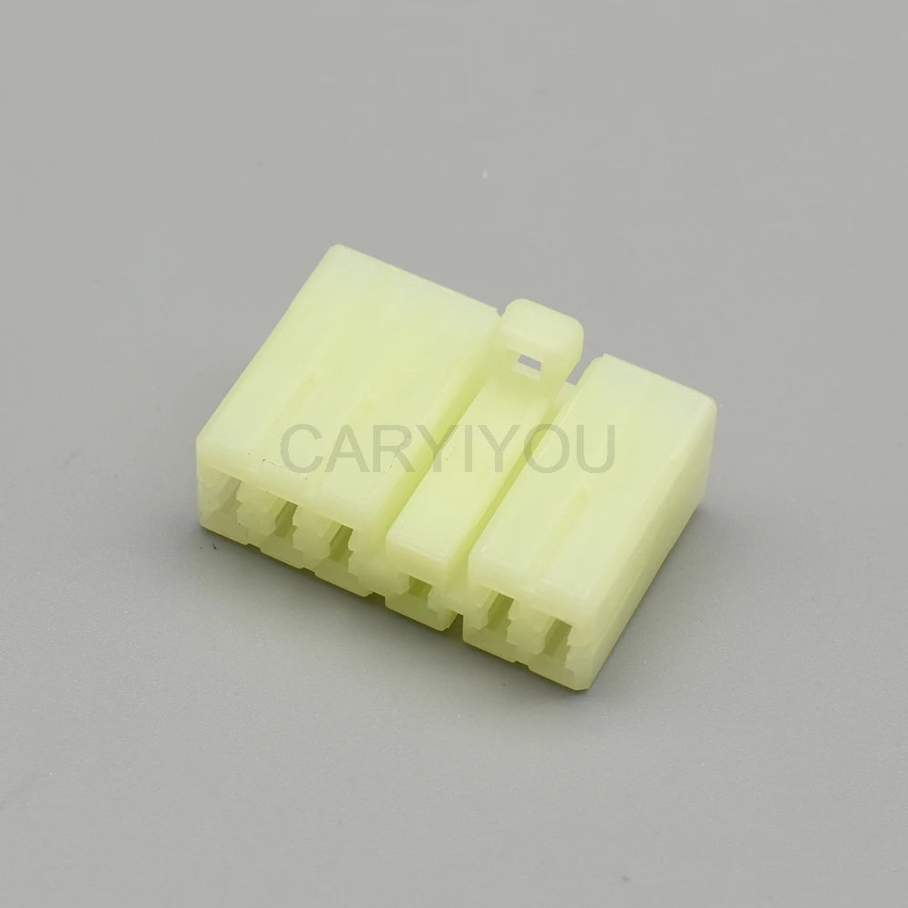 11 pin light yellow female car connector showing terminal layout and locking design for audio plug