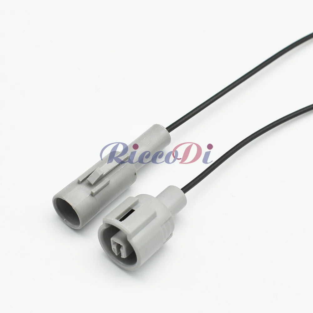 Close-up of 1 Pin grey automotive sensor connector showing male and female terminals for secure electrical connection