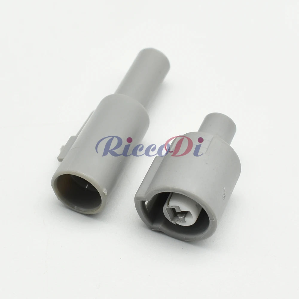 Close-up of 1 Pin grey automotive sensor connector showing male and female terminals for secure electrical connection