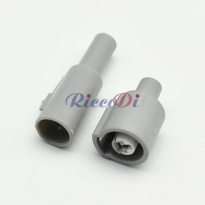 Close-up of 1 Pin grey automotive sensor connector showing male and female terminals for secure electrical connection