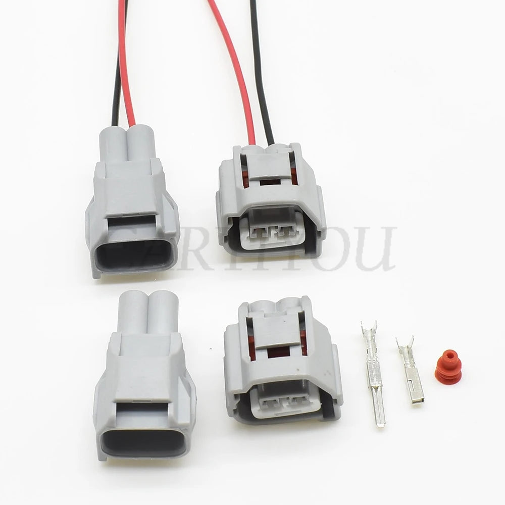 Close-up view of 2.2mm male and female sealed automotive connector interface for reliable electrical contact