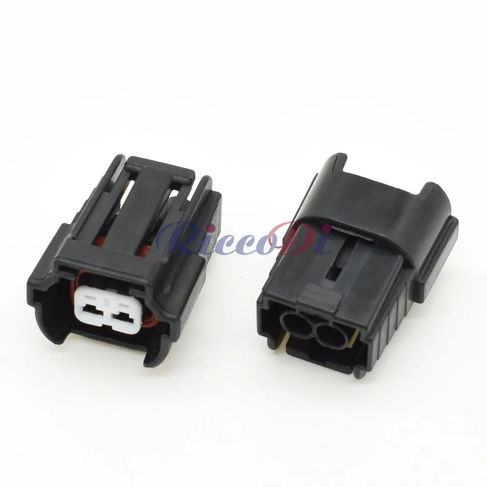 Demonstration of 2 hole auto fuel injector wire socket connector fitting into VW and Nissan car wiring harness