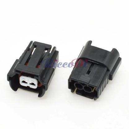 Demonstration of 2 hole auto fuel injector wire socket connector fitting into VW and Nissan car wiring harness