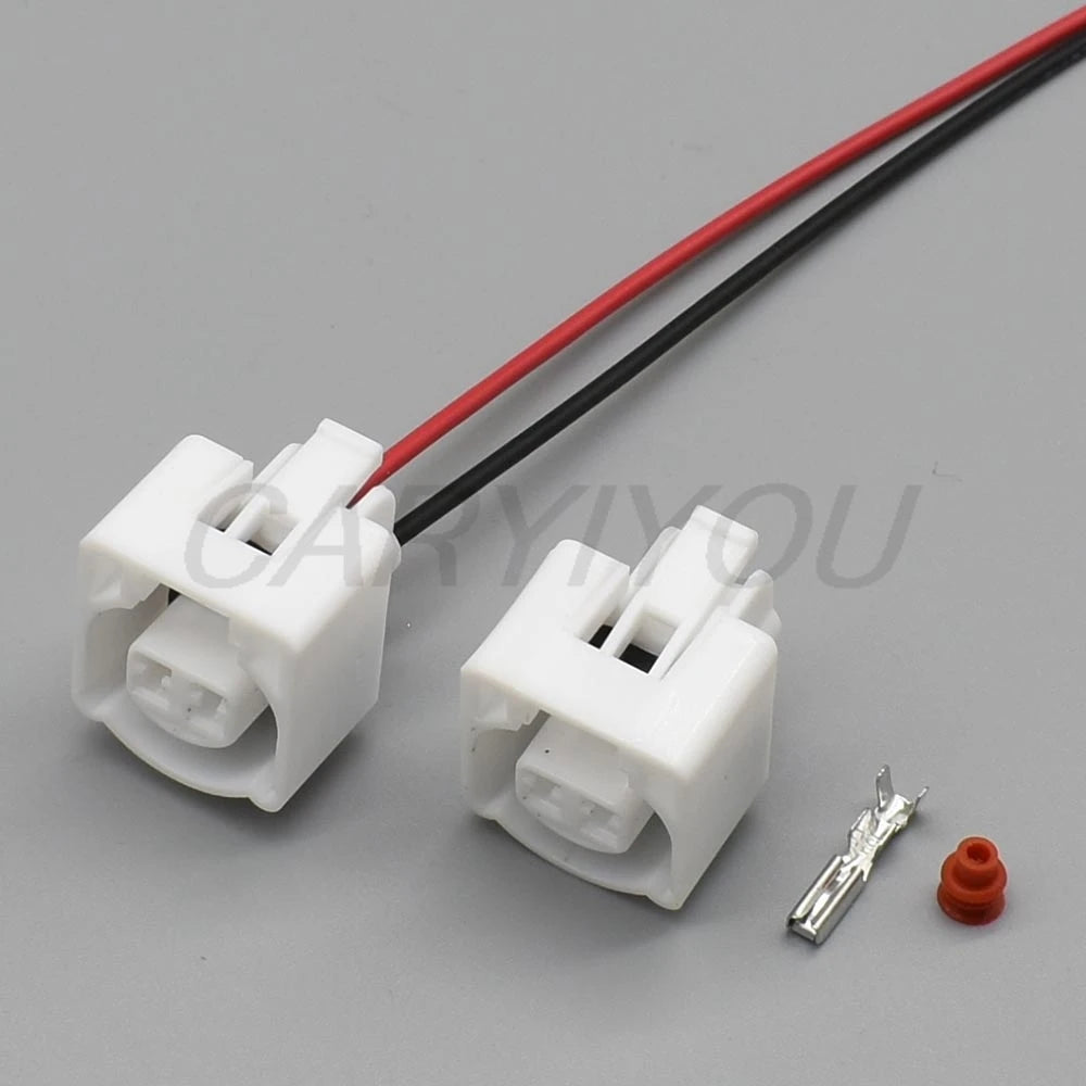 White 2 pin automotive intake air temperature sensor connector installed for secure vehicle wiring connections