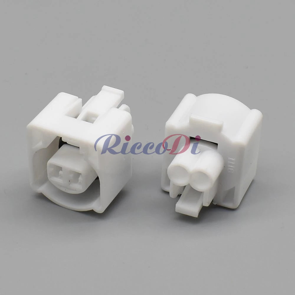 Close-up view of 2 pin female plug on white automotive intake air temperature sensor waterproof connector