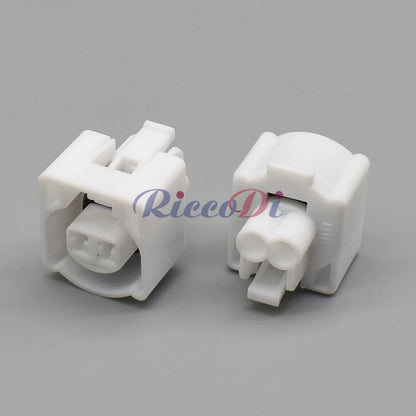 Close-up view of 2 pin female plug on white automotive intake air temperature sensor waterproof connector