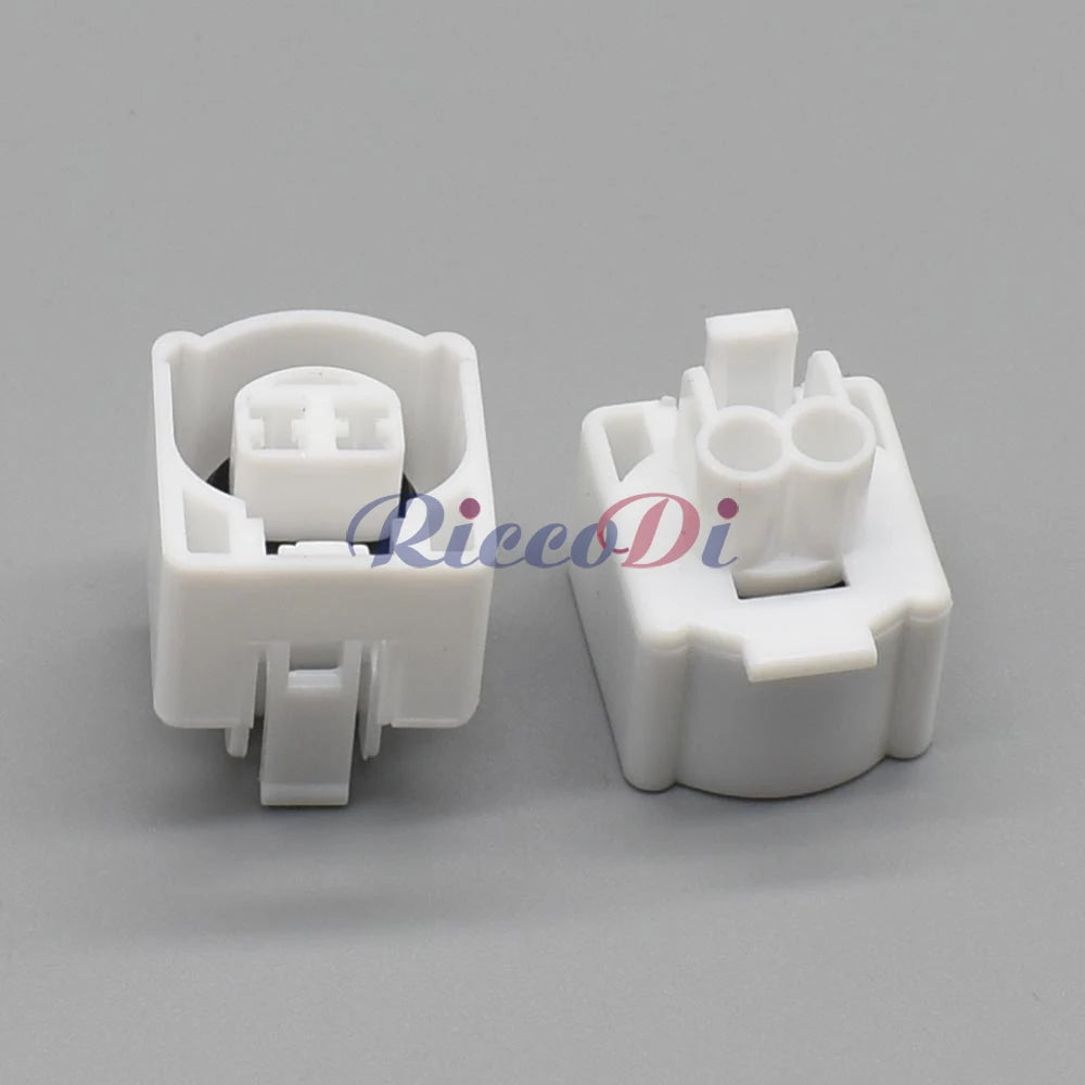 Detail of wires attached to white 2 pin automotive intake air temperature sensor waterproof connector