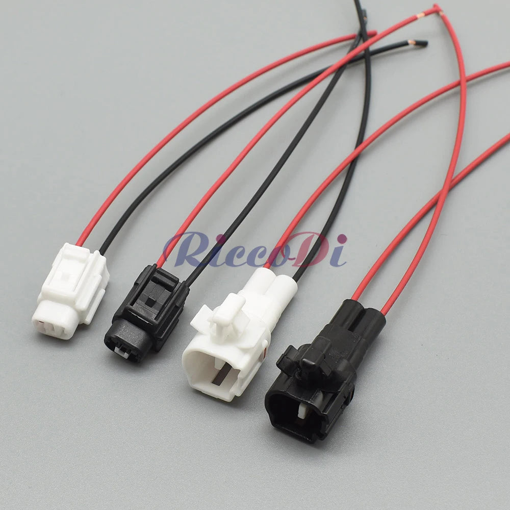 Demonstration of 2-pin black automotive connector fitting into car wiring harness for easy installation
