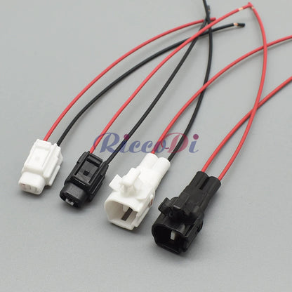 Demonstration of 2-pin black automotive connector fitting into car wiring harness for easy installation