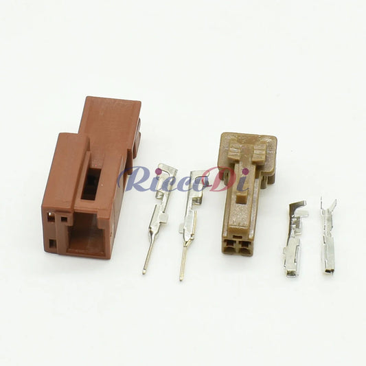 Close-up view of 2 pin automotive wire connector showing secure male and female socket interface