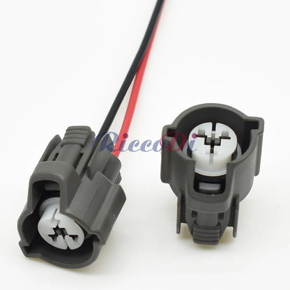 Demonstration of female 2 pin fuel injector plug fitting into automotive wiring harness for precise installation
