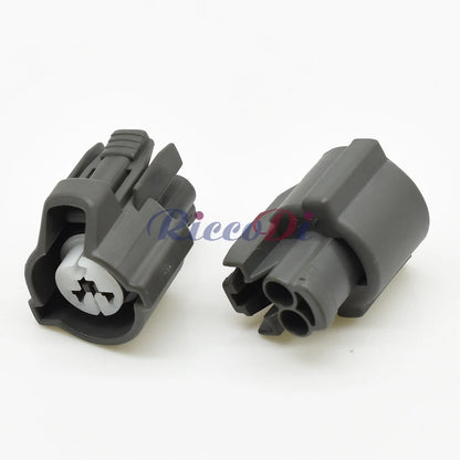 Close-up of terminal pins on female 2 pin fuel injector plug showing secure electrical connection