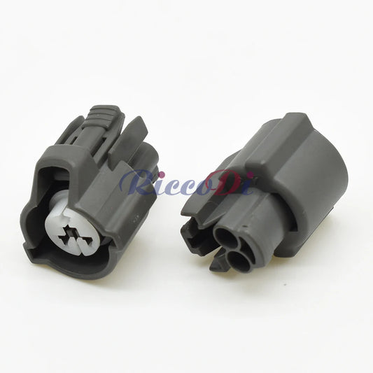 Close-up of terminal pins on female 2 pin fuel injector plug showing secure electrical connection