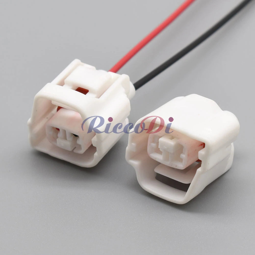 Rear view of 2-pin waterproof automotive connector highlighting wire attachment for AC assembly