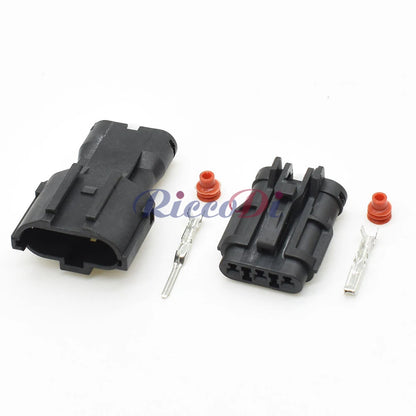 Close-up of black 3-pin automotive wire connector adapter MG640329-5 MG610327-5 showing male female connection