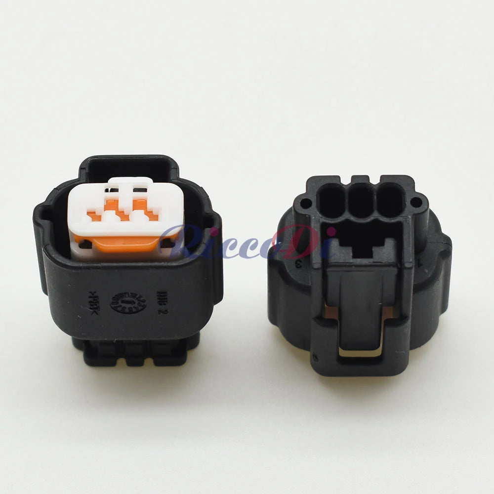 Detailed view of waterproof seal and pins in 3-pin automotive electrical connector for Mitsubishi