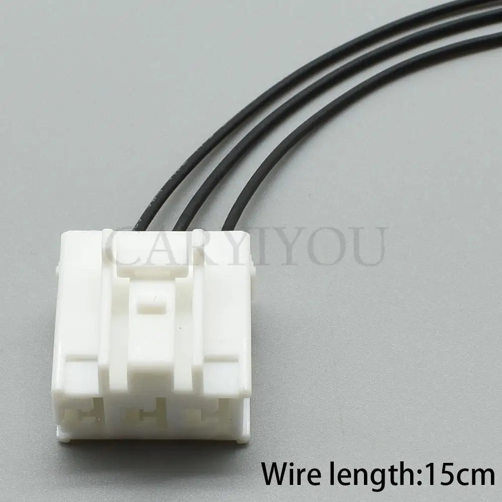 Detailed view of waterproof seal and pins in 3-pin automotive wire harness connector