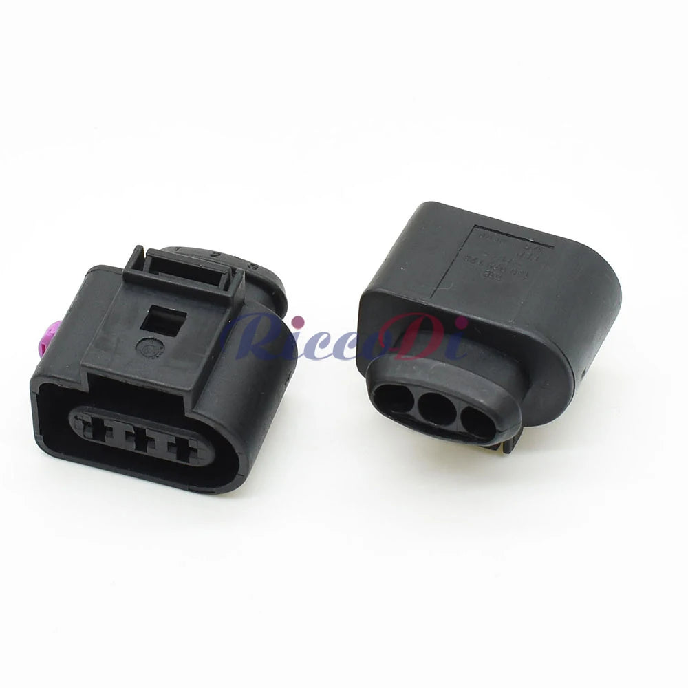 Close-up of 3-pin automotive sensor pigtail connector showing 3.5mm female plug and terminals for secure wiring