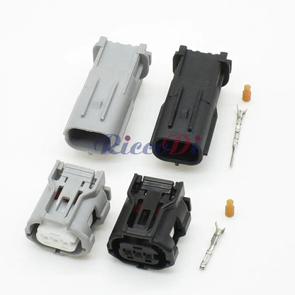 Close-up of 3-pin headlight camshaft sensor plug showing secure male and female terminals for Toyota and Lexus vehicles