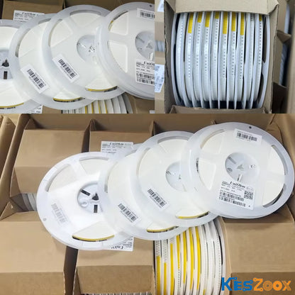UniOhm brand SMD chip resistor tape-and-reel stock — multiple white reels with UniOhm barcode labels, yellow carrier tape, 0402 0603 0805 1206 SMD resistors in full reel 5000pcs 10000pcs packaging — ready stock for PCBA pick-and-place machine loading at Keszoox