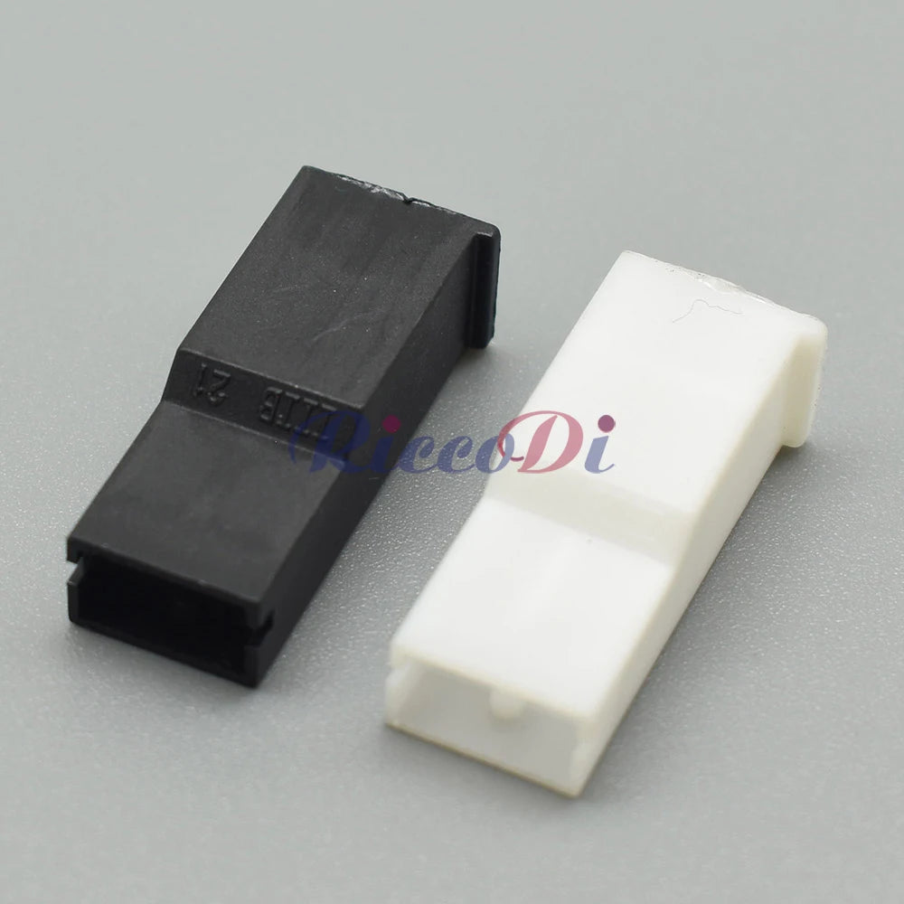 Close-up of black and white plastic female plug on 6.3 series automotive wiring harness connector 171809-3