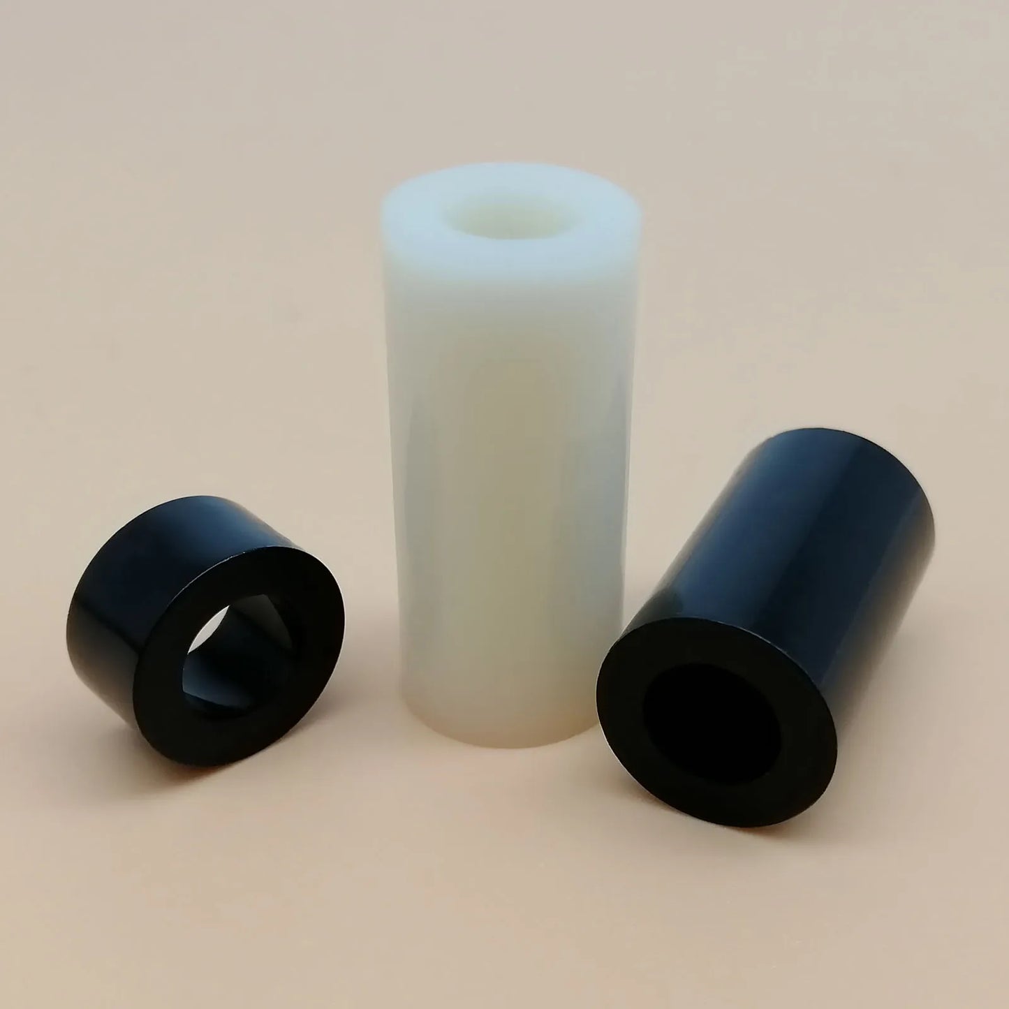 Black_and_white_ABS_nylon_standoff_washer_for_electronics_and_TV_installation