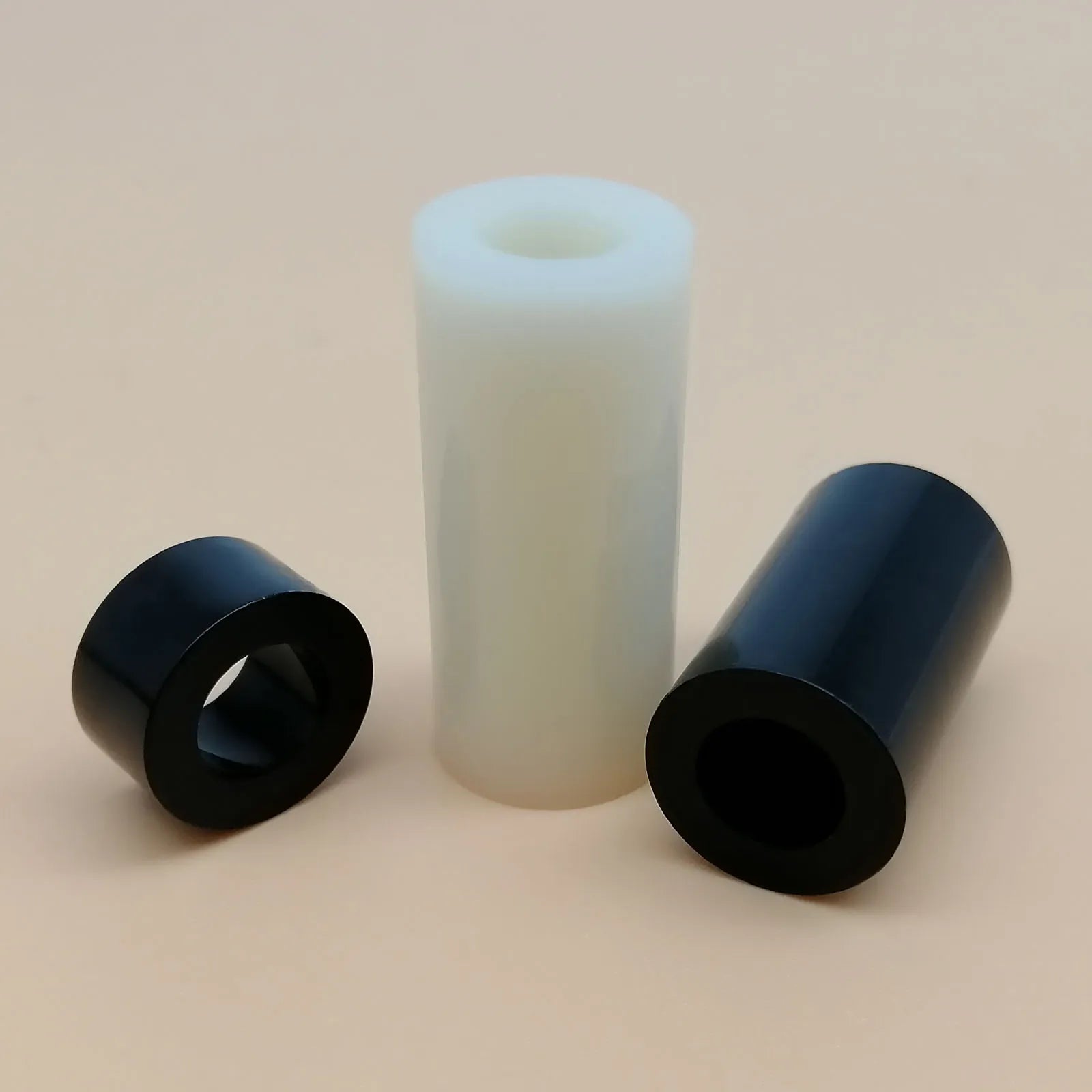 Black_and_white_ABS_nylon_standoff_washer_for_electronics_and_TV_installation