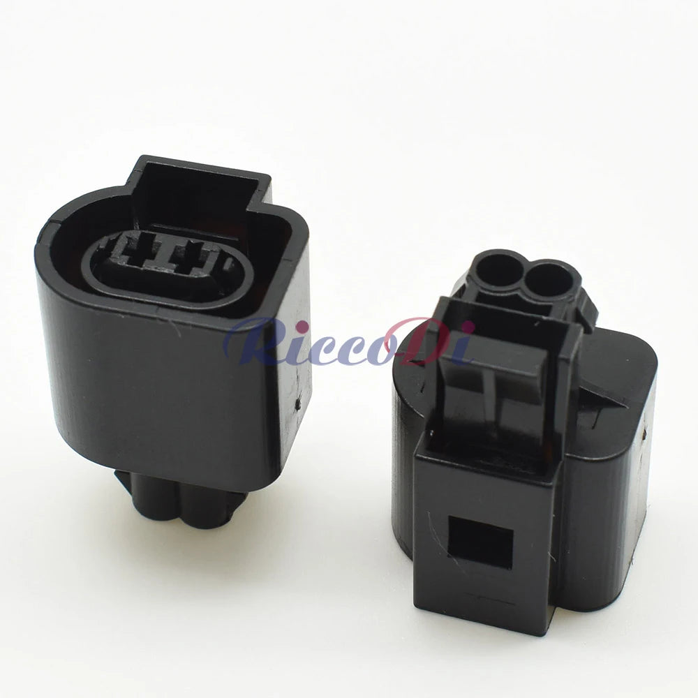 Close-up of 2-pin ABS sensor connector 6N0973702 highlighting secure pins and waterproof housing