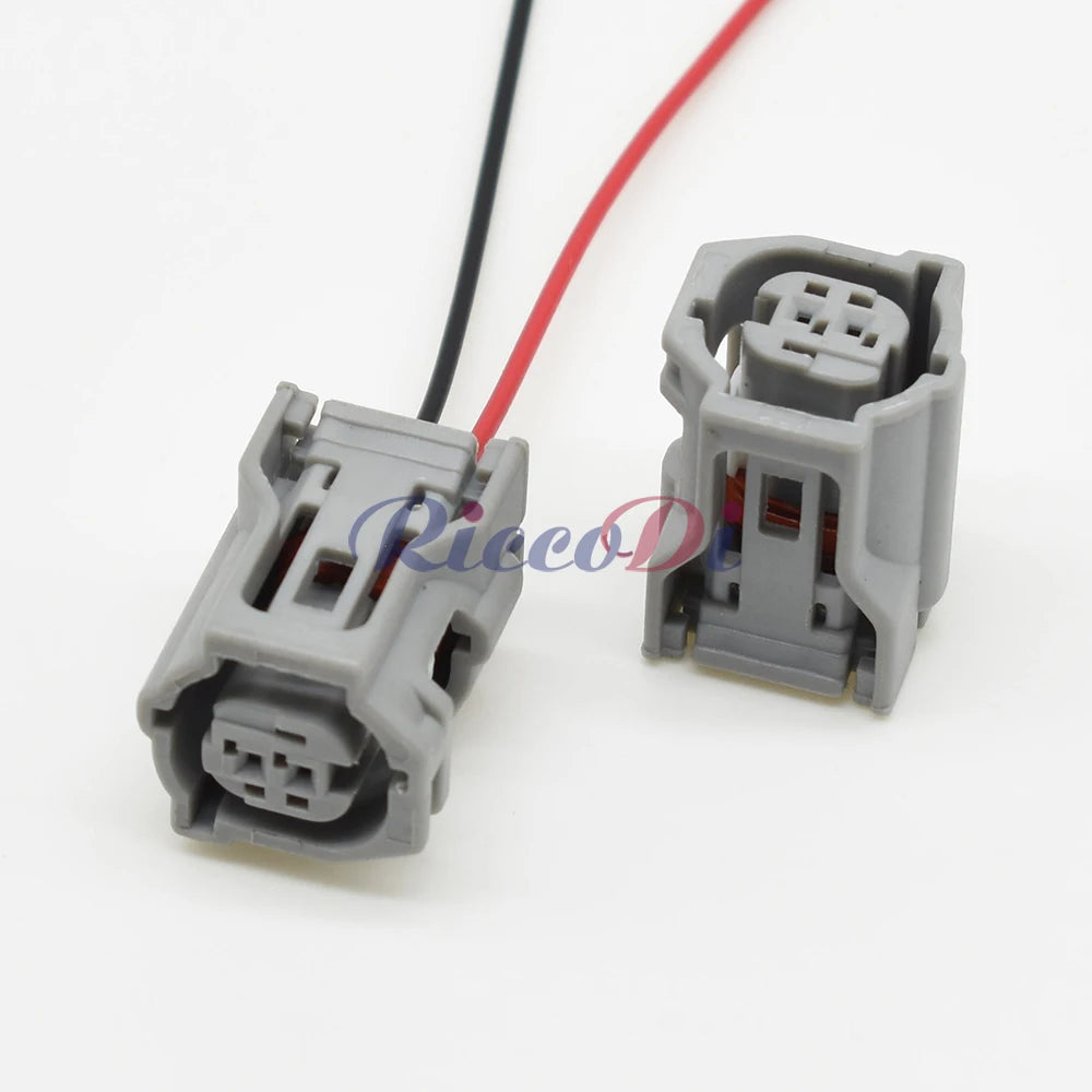 Demonstration of 2-hole AC assembly car connector fitting into automotive wiring harness