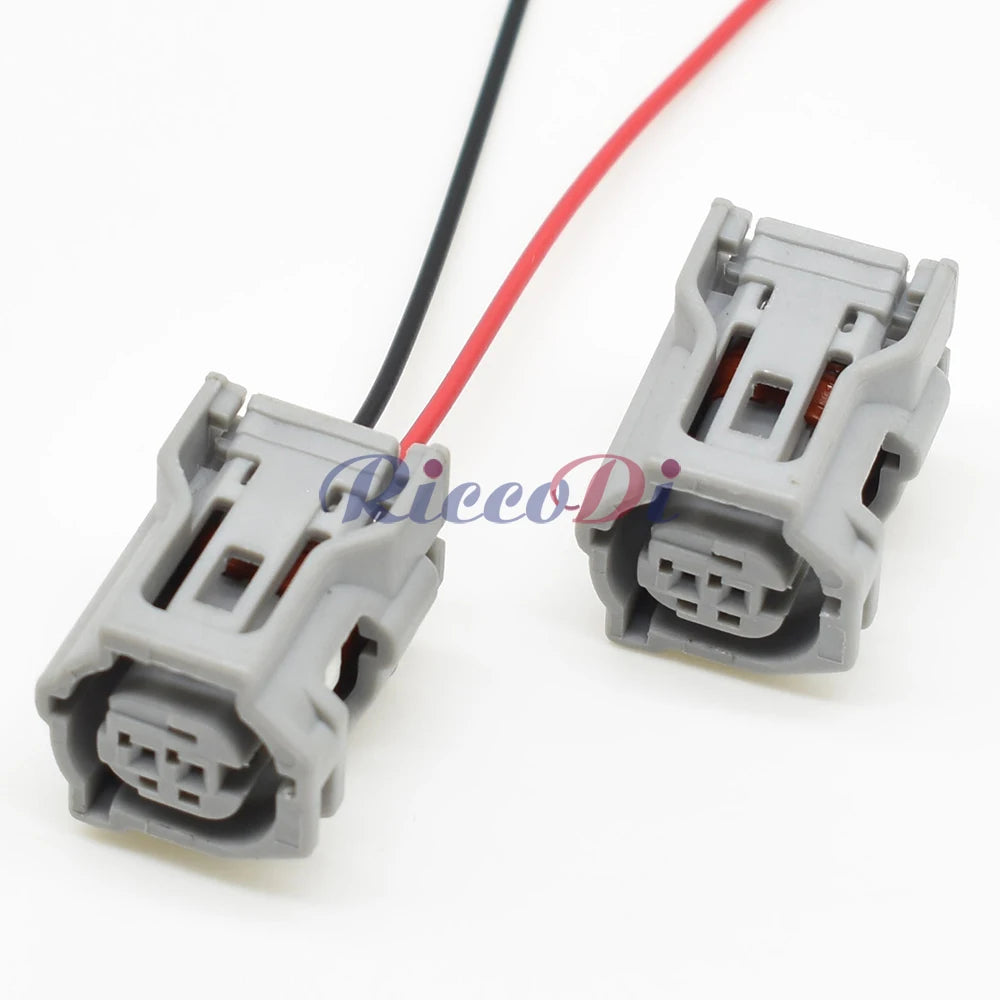 Detailed view of ABS sensor plastic housing on 2-hole AC assembly car wire socket