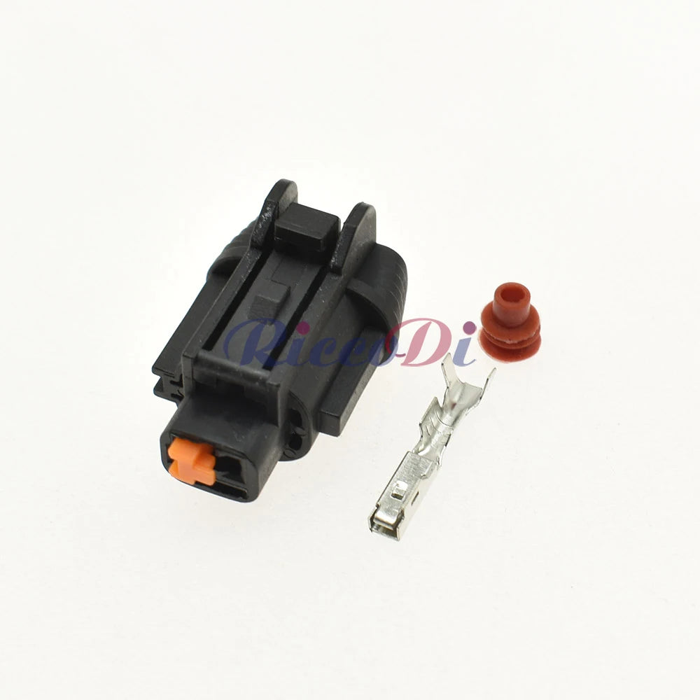 Close-up of automotive connector showing terminal pins and socket interface for reliable AC compressor pump connection