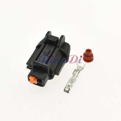 Close-up of automotive connector showing terminal pins and socket interface for reliable AC compressor pump connection