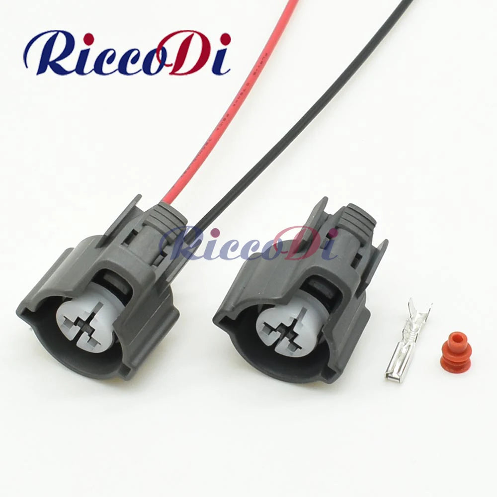 Automotive 2-pin male female wire harness connector DJ70230C showing complete plug and socket assembly