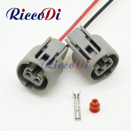 Automotive 2.2mm 2-pin wire harness connector showing complete plug and socket assembly